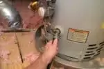 water heater with drain pan underneath