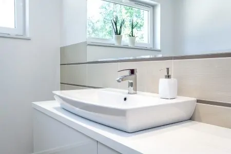 A white bathroom faucet