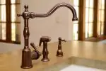 A vintage bronze kitchen faucet