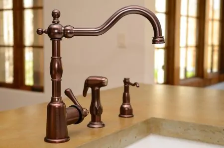 A vintage bronze kitchen faucet