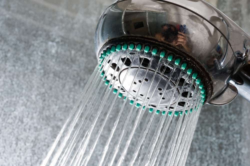 Remove flow restrictor from shower head