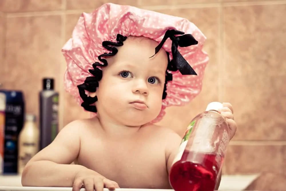 Toddler wearing a shower cap