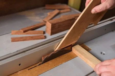 Working on a table saw while using a push stick