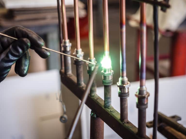 Welding of brass fittings on copper pipe.