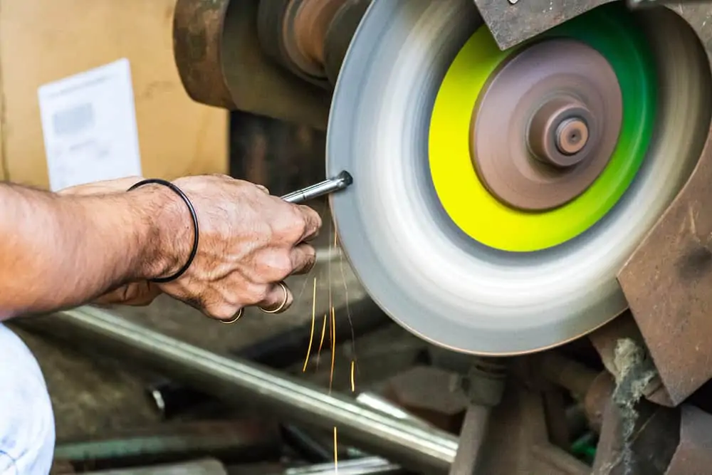 Sharpening drill bit on a bench grinder