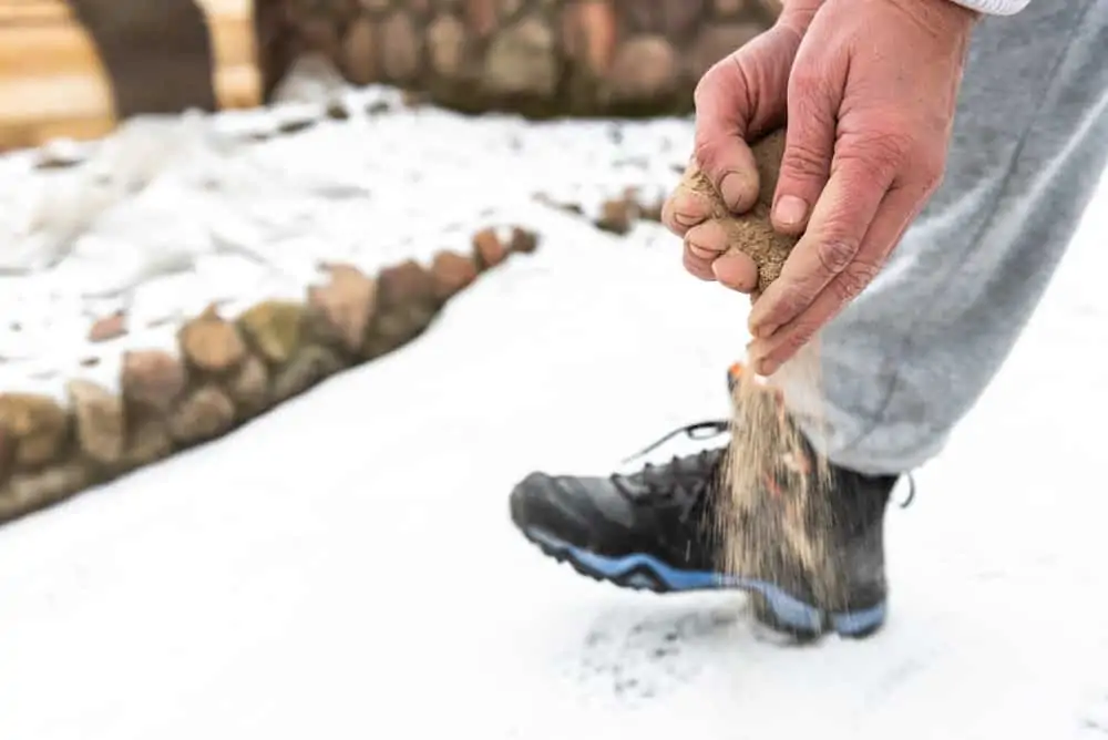 Sanding snow covered ground