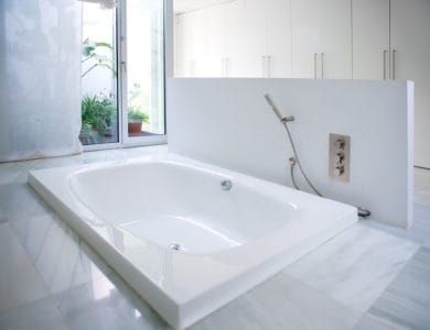 Modern white house bathroom bathtub with courtyard skylight