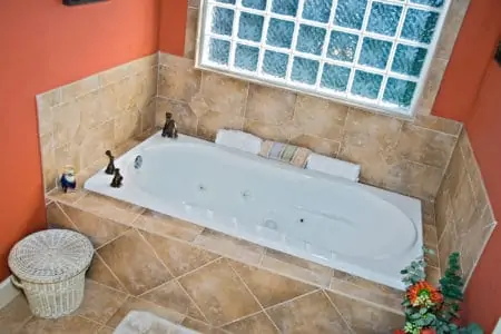 Modern colorful bathroom tub area.