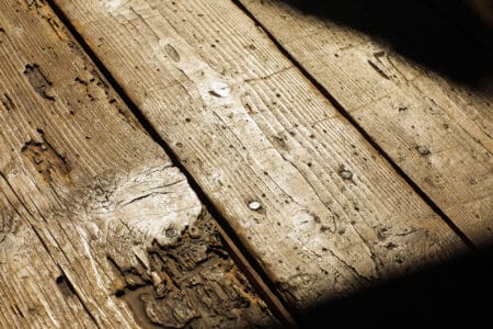Old wood floor with cracks closeup