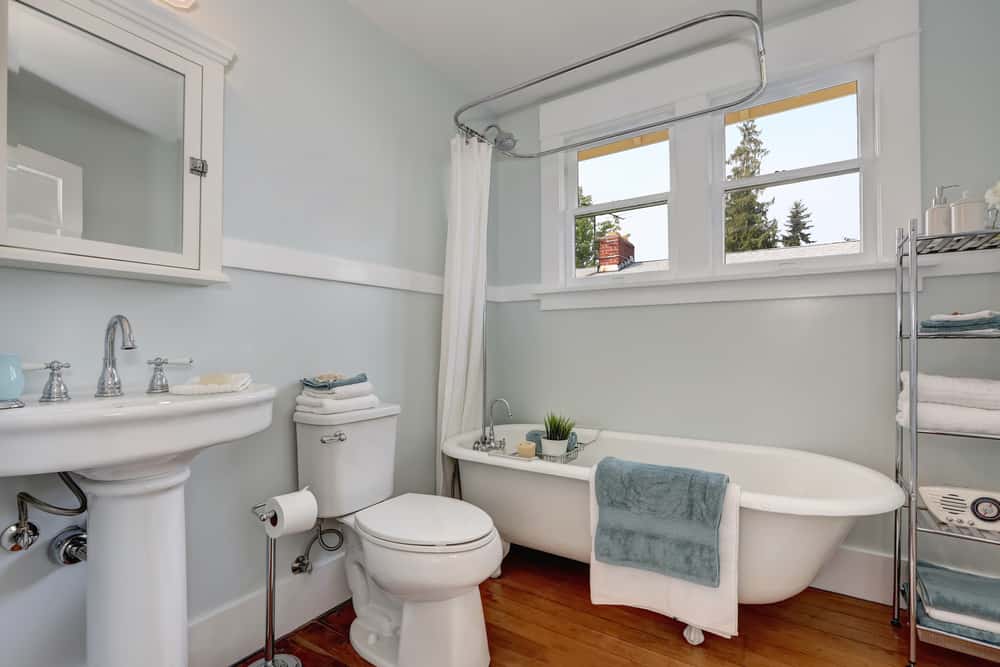 Interior design of craftsman bathroom with pastel blue walls
