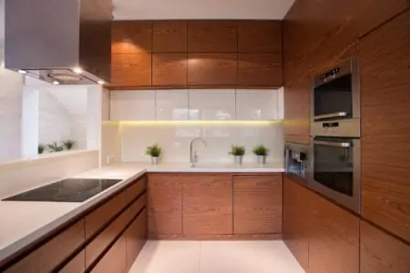 Wooden kitchen cabinet in brown white kitchen