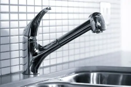 Silver kitchen faucet closeup