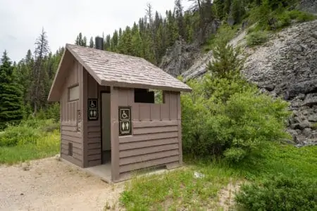 Rustic pit toilet in the outdoors