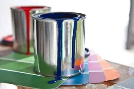 Paint cans with spilling paint