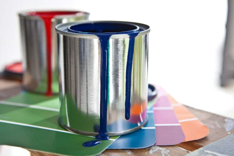 Paint cans with spilling paint