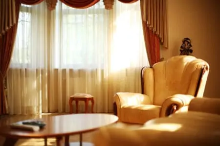 Luxury interior with leather armchair. Shallow DOF.