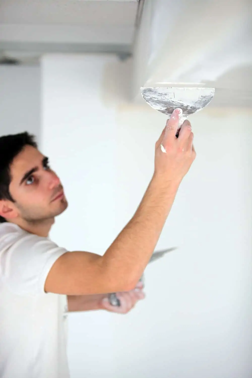 Man plastering a ceiling