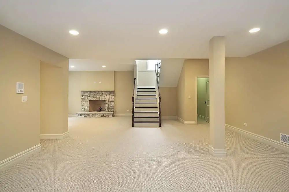 Basement with stone fireplace