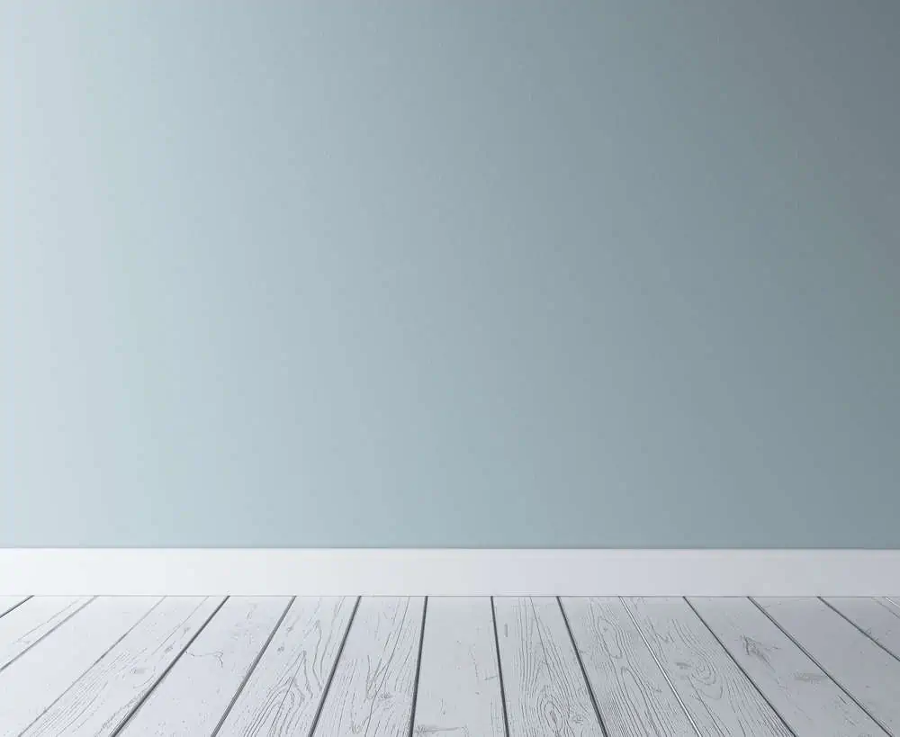 blue concrete wall and wood floor