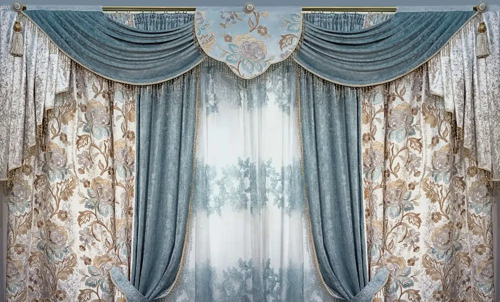 Luxury interior is decorated in the palace style. Curtains, pelmet and tulle from natural materials