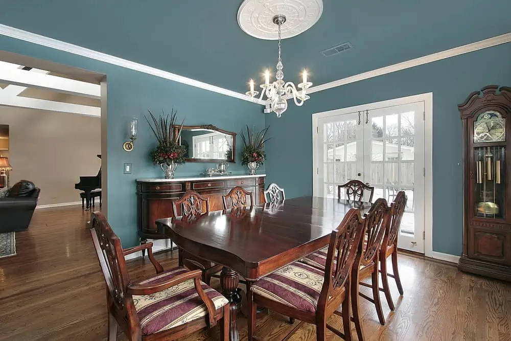 Elegant dining room with slate blue walls