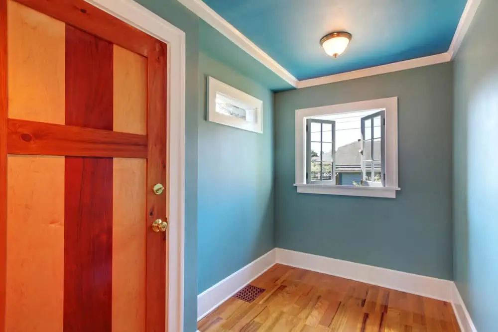 Cutom build beautiful wood door in blue empty room