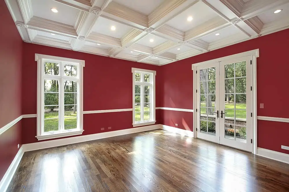 Library in new construction home with red walls
