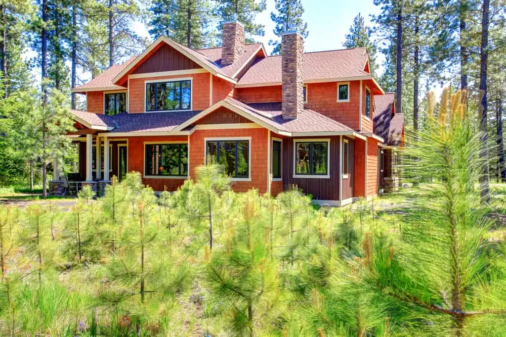 Beautiful brown and orange house. Vibrant colors stand out the green landscape