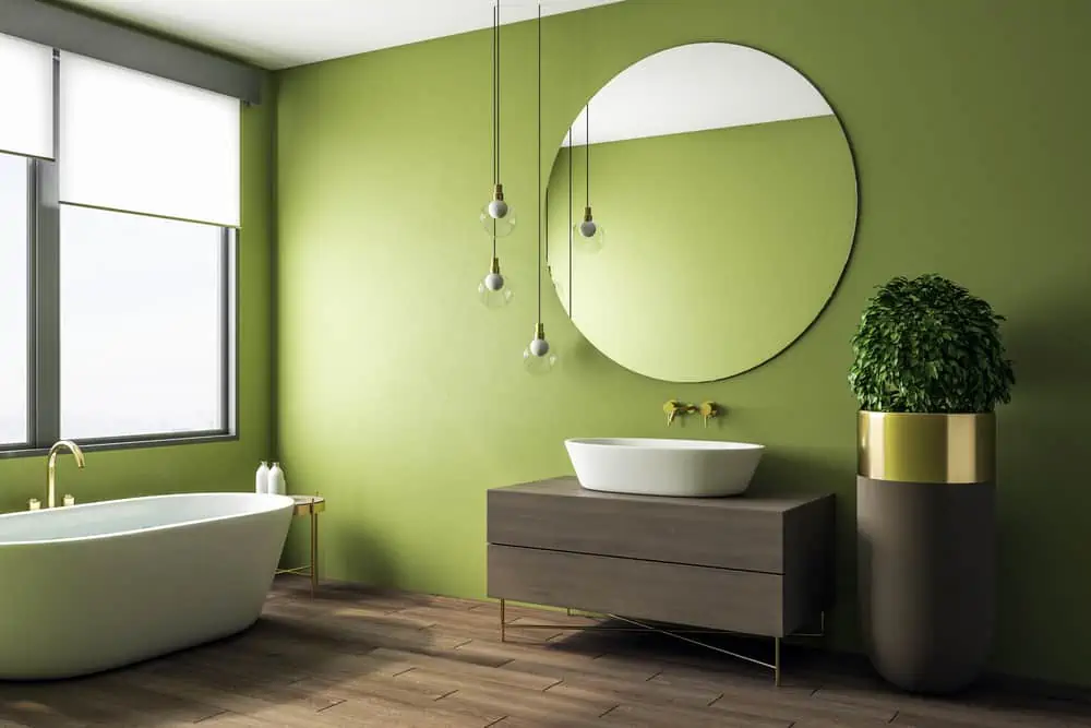 Clean green bathroom interior with appliances and decorative pot tree. Design and real estate concept. 3D Rendering