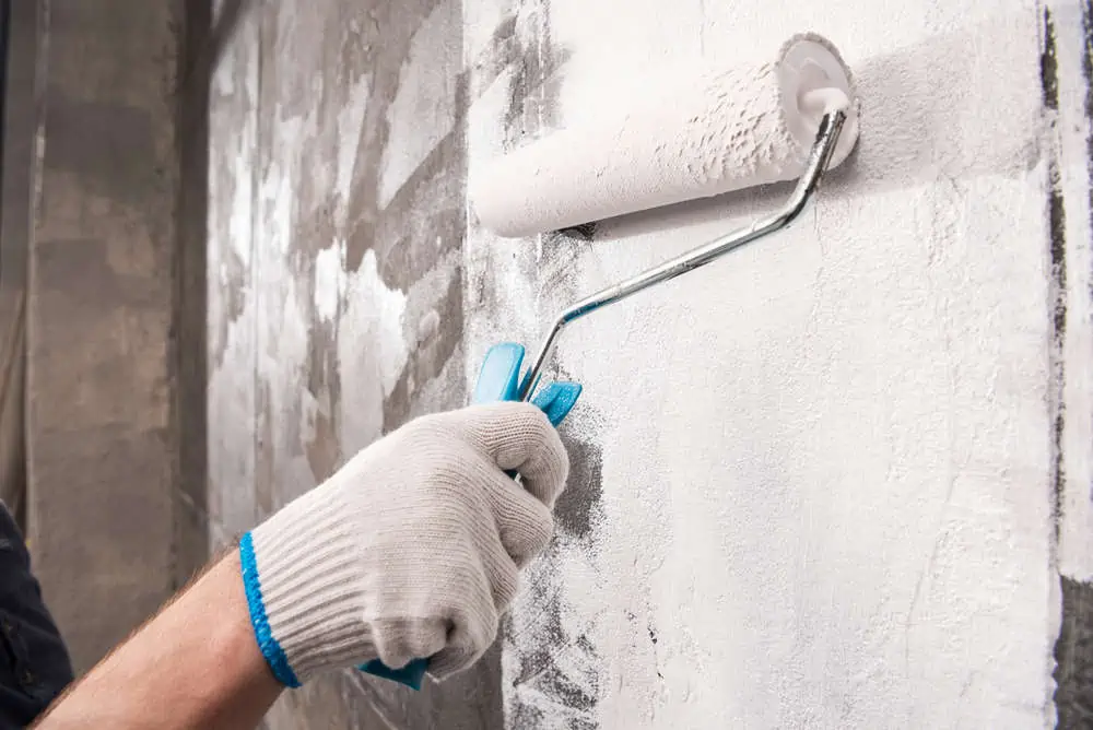 man painting wall