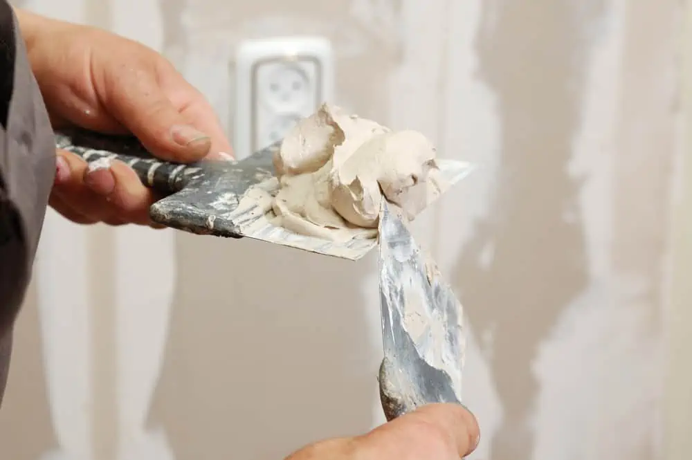man working with plaster