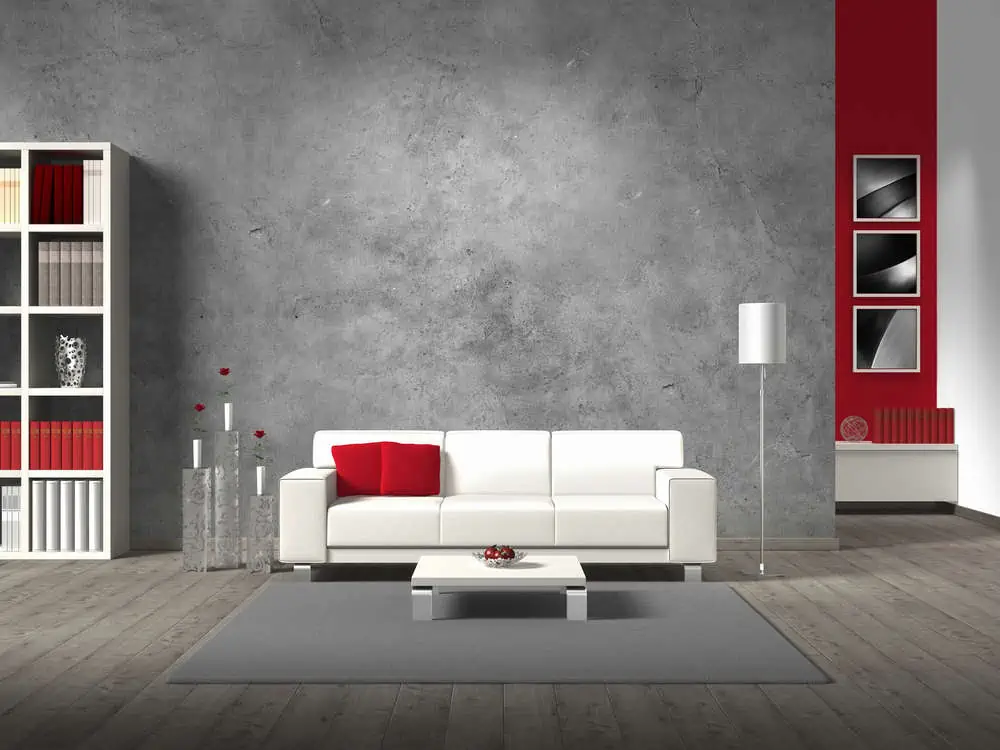modern fictitious living room with white sofa and copy space for your own image/photos on the concrete wall behind the sofa; the photos in the background are taken by me - no rights are innfringed