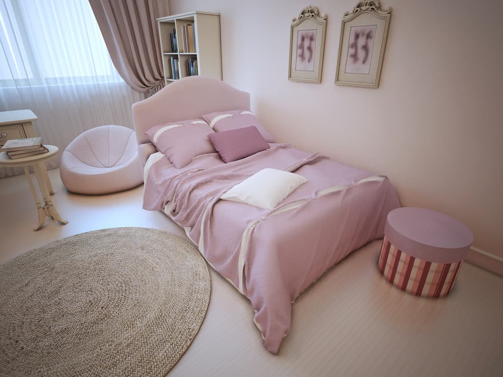 Bed in provence styled bedroom. Dressed bed with pillows and blanket light pink color in luxury child room with light tone walls, linoleum and large round carpet. 3D render