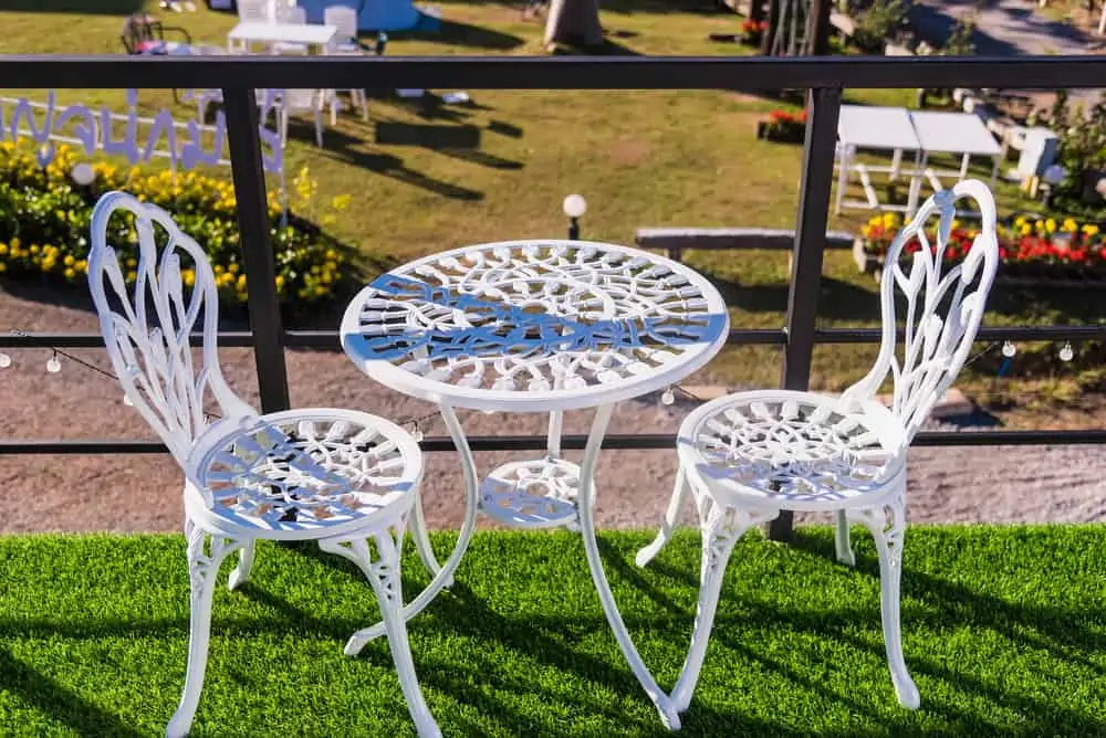 White steel tables and chairs in beautiful nature.