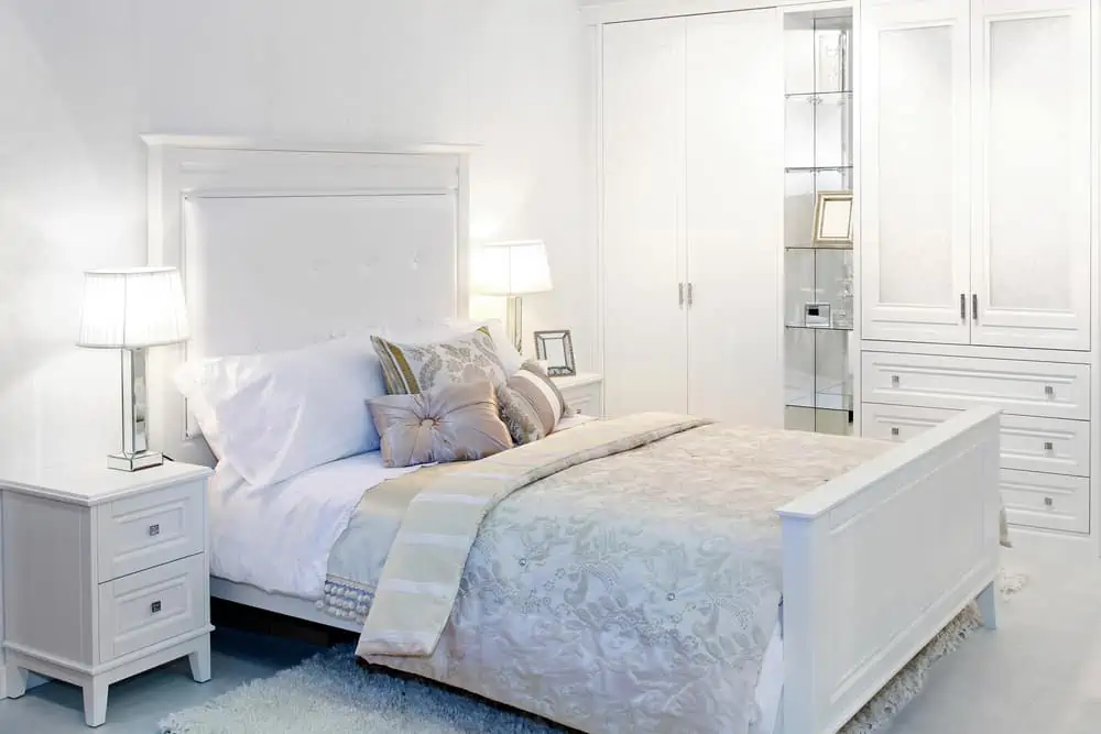 Elegant fancy white bedroom with double bed