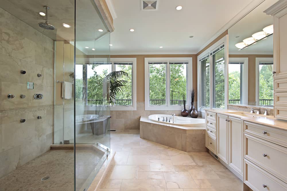 Master bath in new construction home with large glass shower