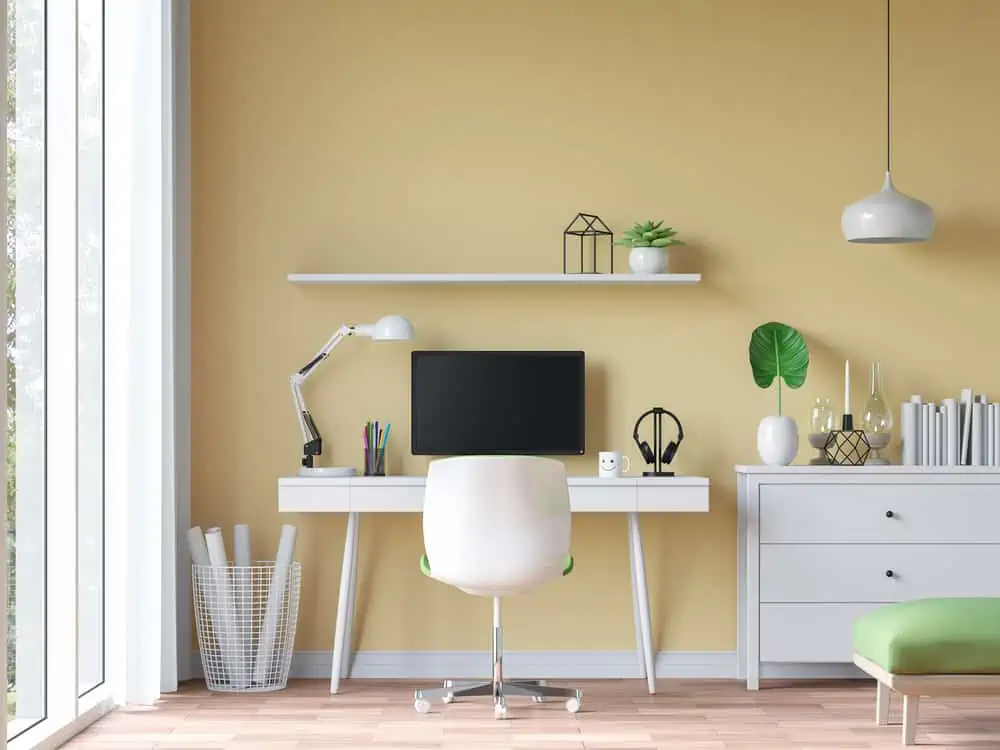 Modern vintage working room with yellow wall 3d rendering image.There are wood floor decorate wall with yellow paint.There are large windows look out to see the nature