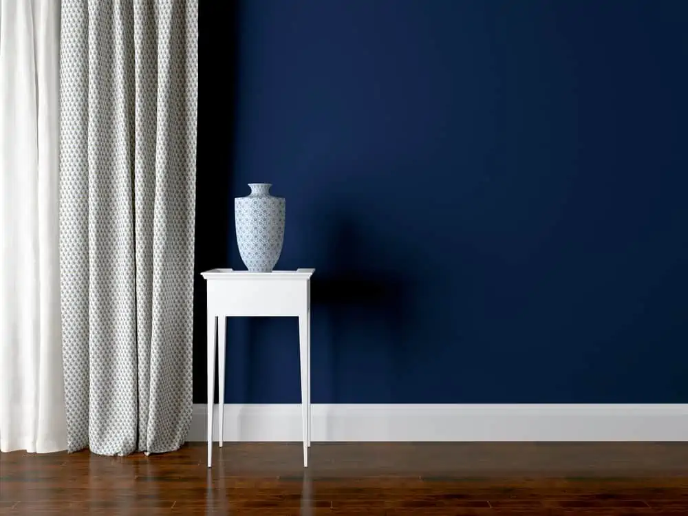 Classic living room wall. Luxury interior design, vase on the table.