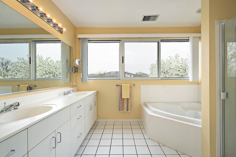 Master bath in home with yellow walls