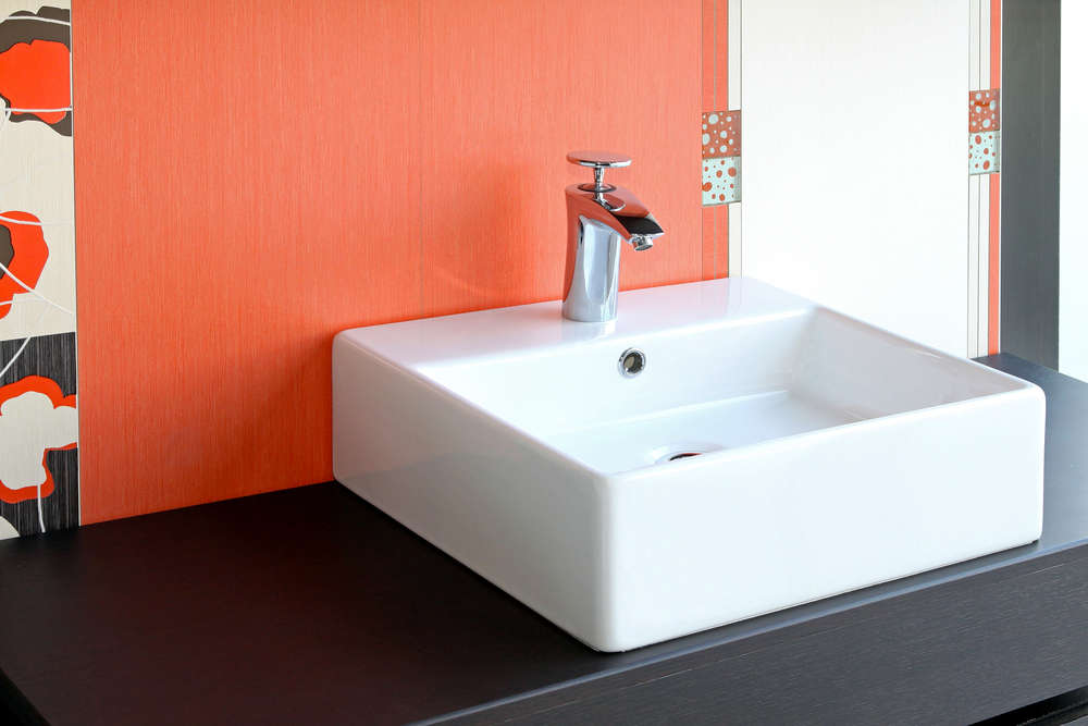 Modern square bathroom sink and red wall
