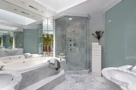 Upscale master bath with marble sink and tub