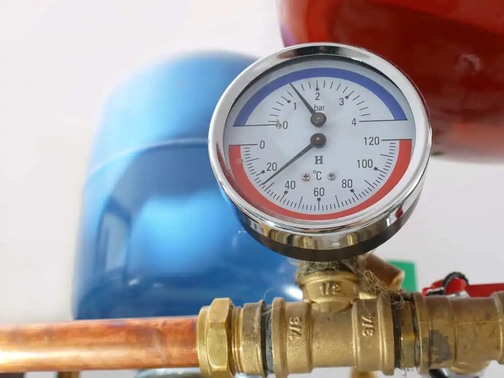 Temperature and pressure gauge mounted on boiler pipes