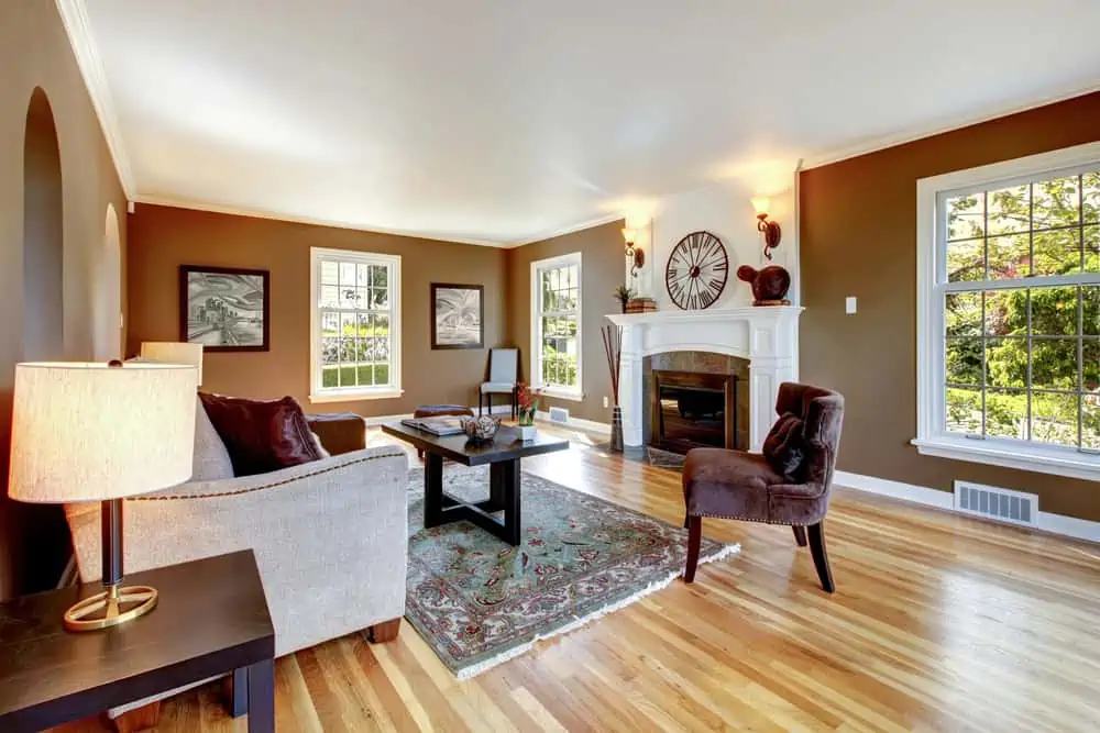 Classic brown and white living room with hardwood floor.
