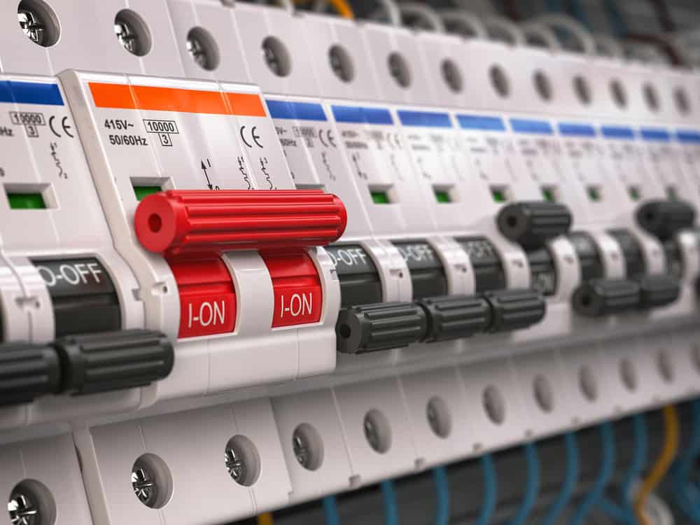 Switches in fusebox. Many black circuit brakers in a row in position OFF and one red switch in position ON. 3d illustration