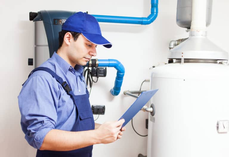 Technician servicing an hot-water heater