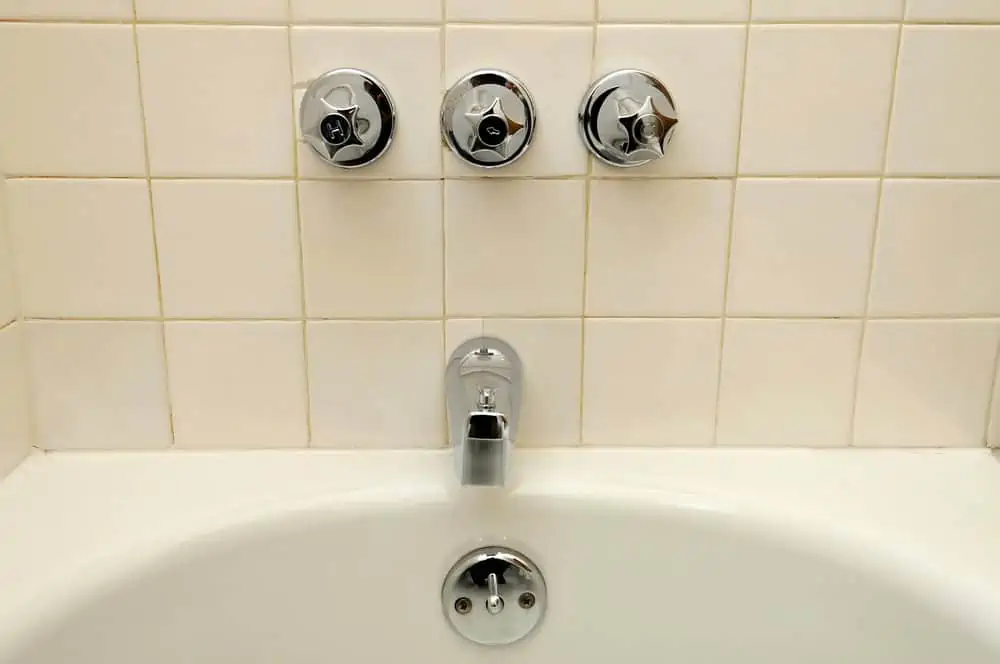 Front view of bathtub and water taps