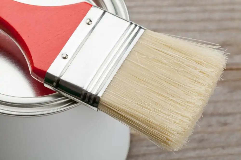 Paint brush on paint can