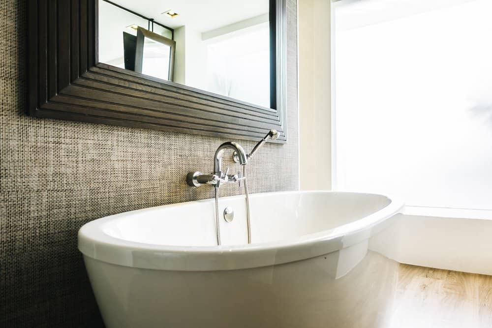 Luxury white bathtub in modern interior