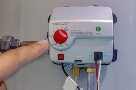 Person adjusting a gas control valve