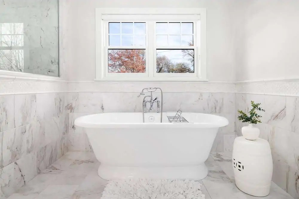 Elegant modern bathroom with white bathtub